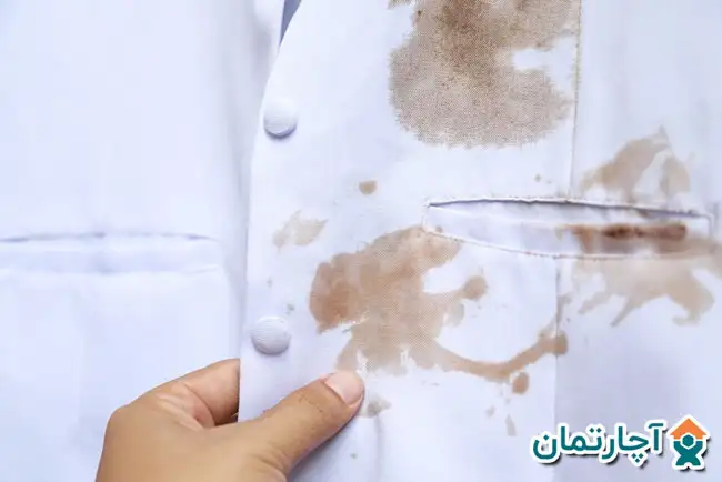 پاك كردن لكه چربی از لباس با پودر بچه