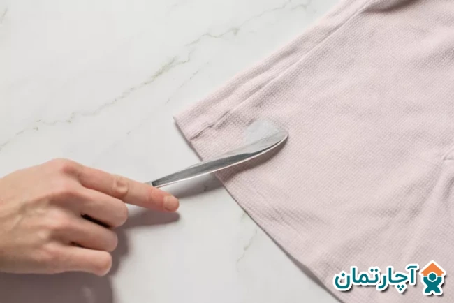 پاك كردن چسب رازی از روي لباس